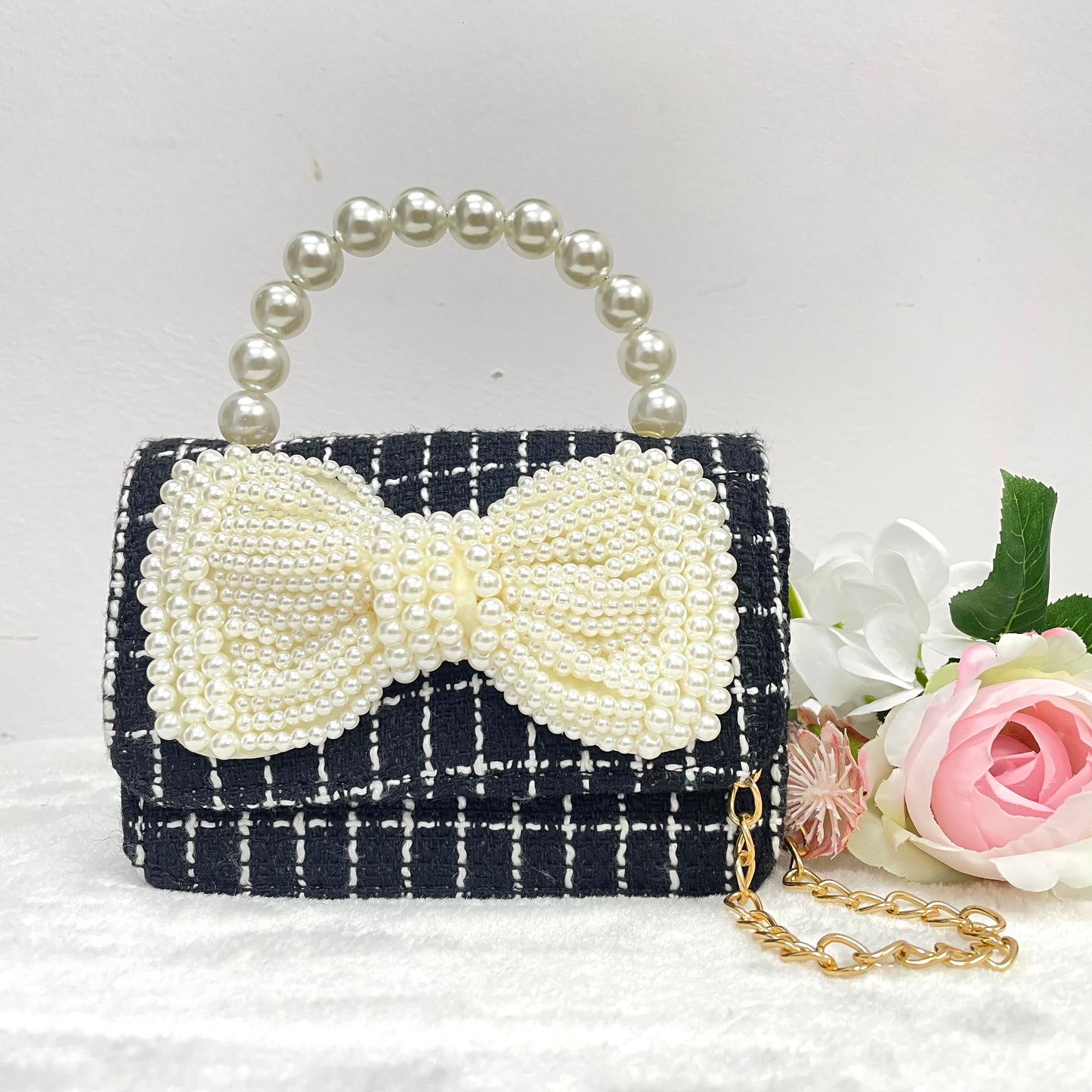 
                  
                    Black And White Tweed Bag With A Crystal Bow
                  
                